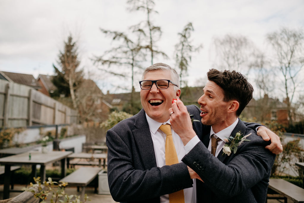 groom and his father joking at an Amalfi White Wedding