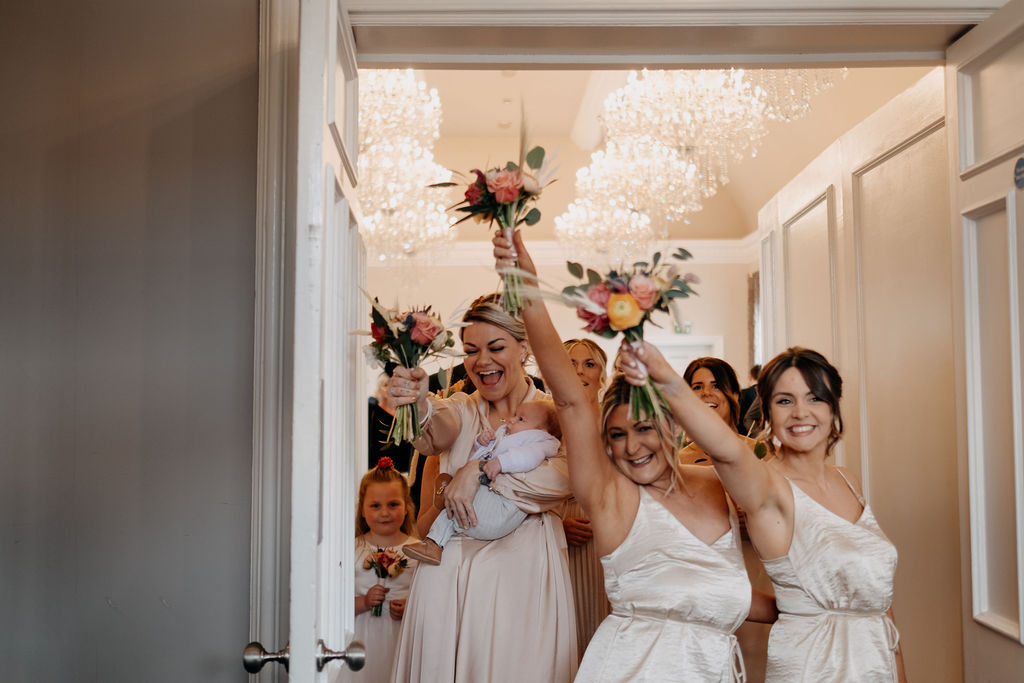bridesmaids happy as they walk back down the asile at amalfi white