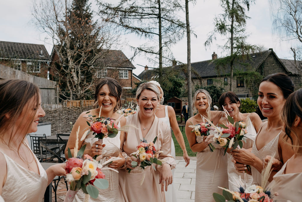 laughing bridesmaids outside at an Amalfi White Wedding