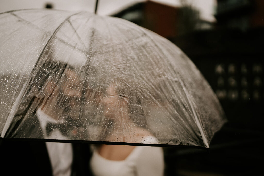 Rainy Wedding Photography Tips - Bride & Groom with umbrella in Kelham Island, Sheffield