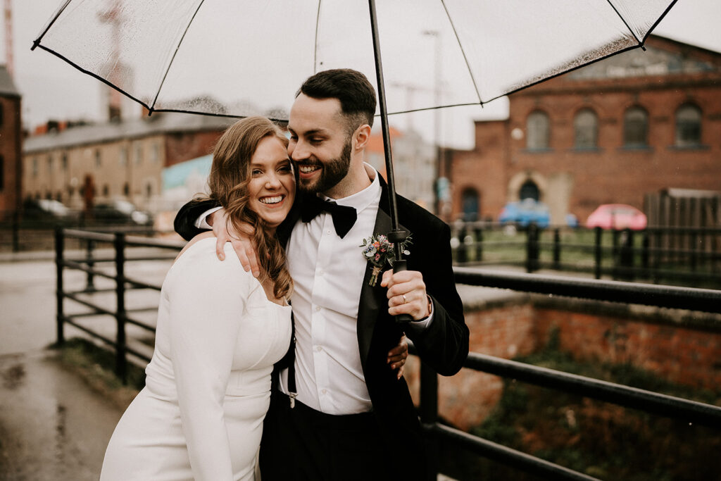 Rainy Wedding Photography Tips - Bride & Groom with umbrella in Kelham Island, Sheffield