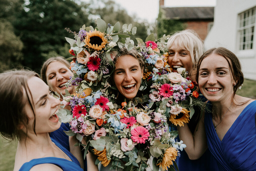bride with a circle of flowers around her A DIY Summer Wedding at Foremark Cottages