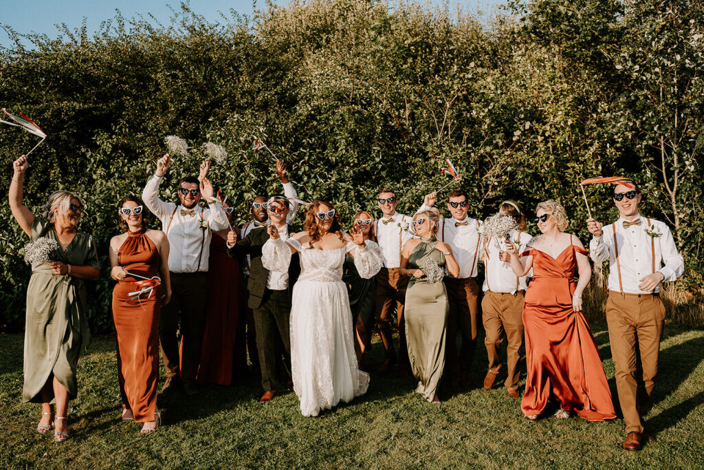 Orange bridesmaids at Royle Forest weddings