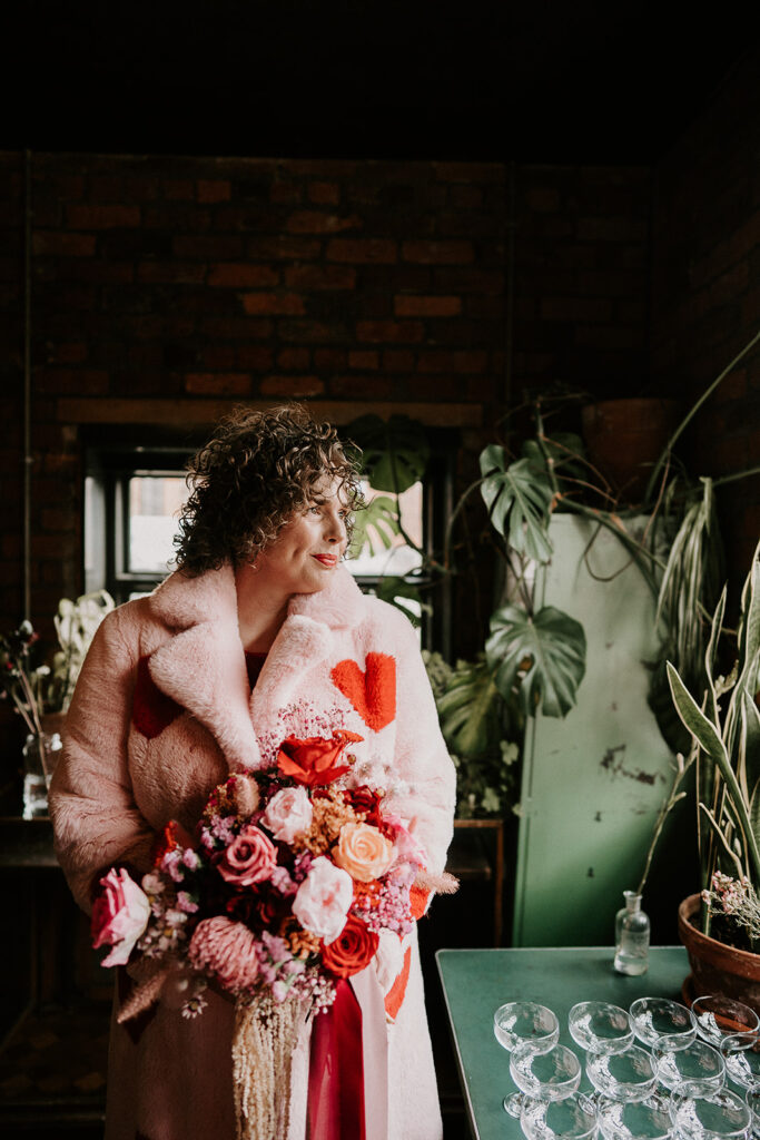 Bride Wears Pink and red Heart Fur coat and a red wedding Dress  | Valentine's Day Wedding at The Chimney House, Sheffield