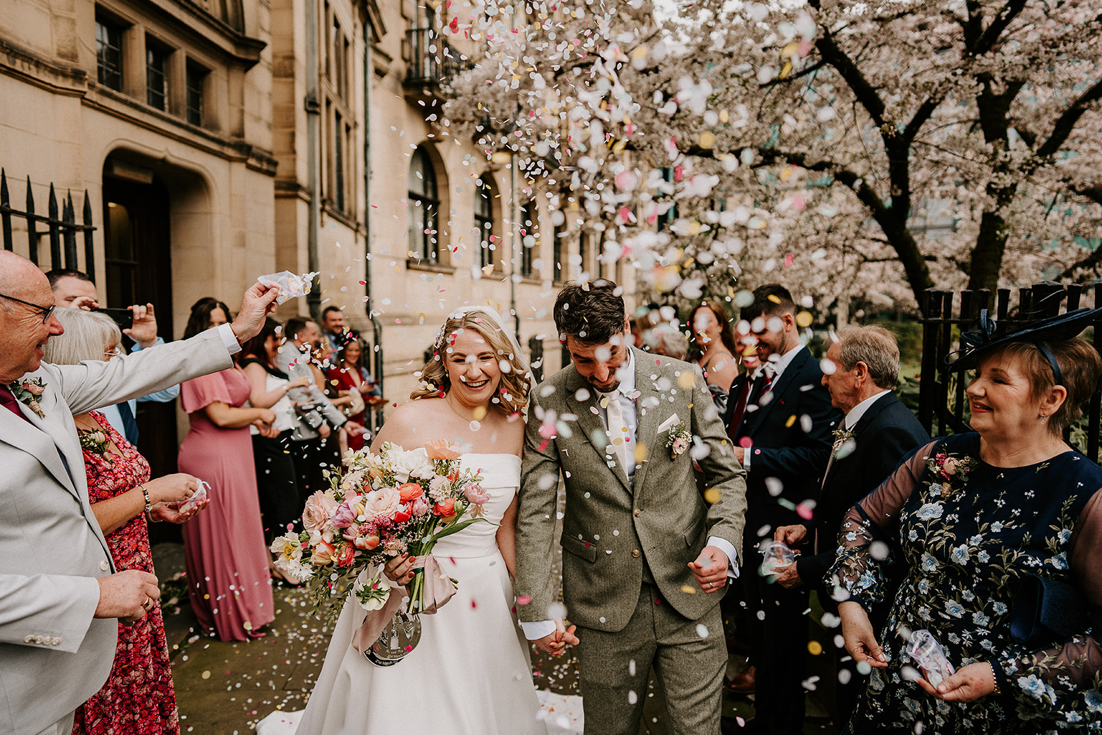 Guests throwing confetti outside Sheffield Registry Office in spring