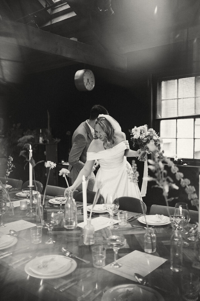 Couple viewing the dining table at The Chimney House